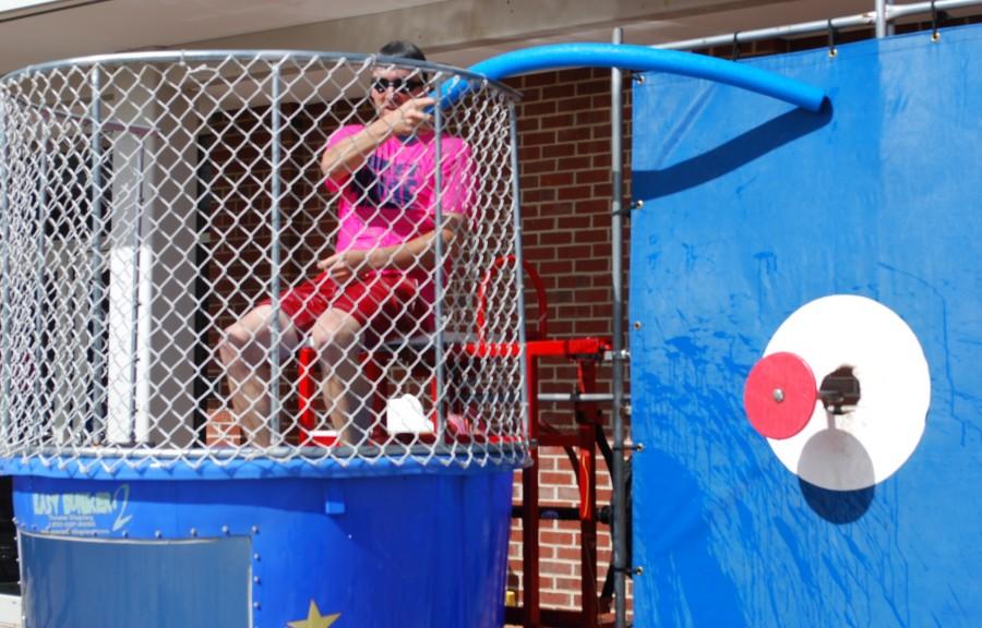 Mr. Staab taunts students as he waits to get dunked. 