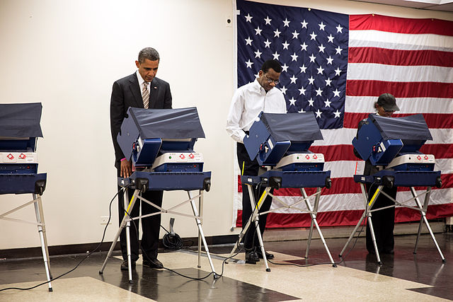 President Obama casts his vote in the 2012 election. Ohio voters will do the same on Tuesday.
