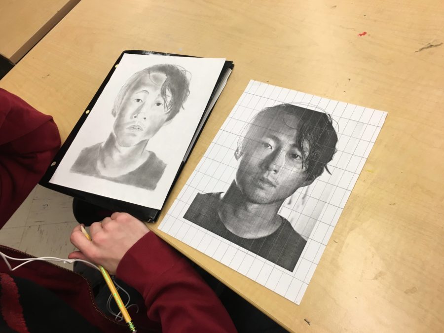 Junior Tyler Cingel working on a portrait.
