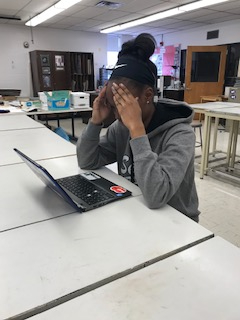 A student stressing over their homework. Photo taken by Nya Perry.