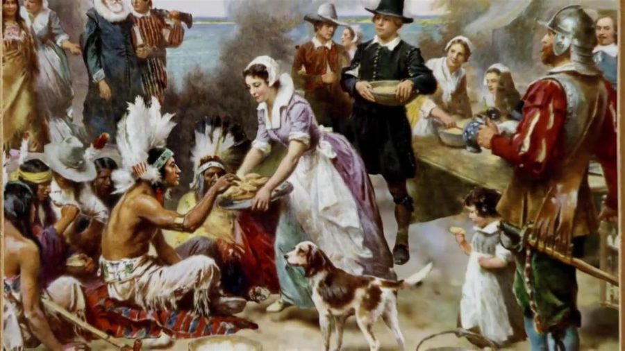The Colonists and Native Americans celebrating the first Thanksgiving.