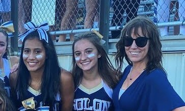 Jessica Birchak (middle) after the first football game Hudson vs. Solon, with Coach Liz Kozar (right) and her teammate Nina Nasca (left)