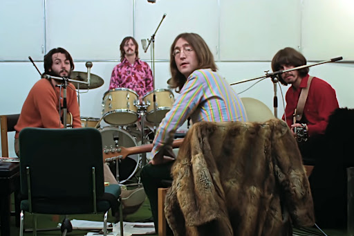A shot from the documentary of the Beatles working on their album.
Taken through Walt Disney Studios