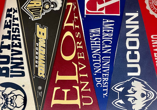 College pennants hanging in the Counseling Office conference room.