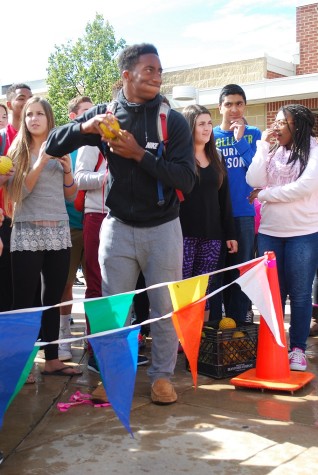 Junior, Drake Perry winds up to take a shot at Mr. Gielink.