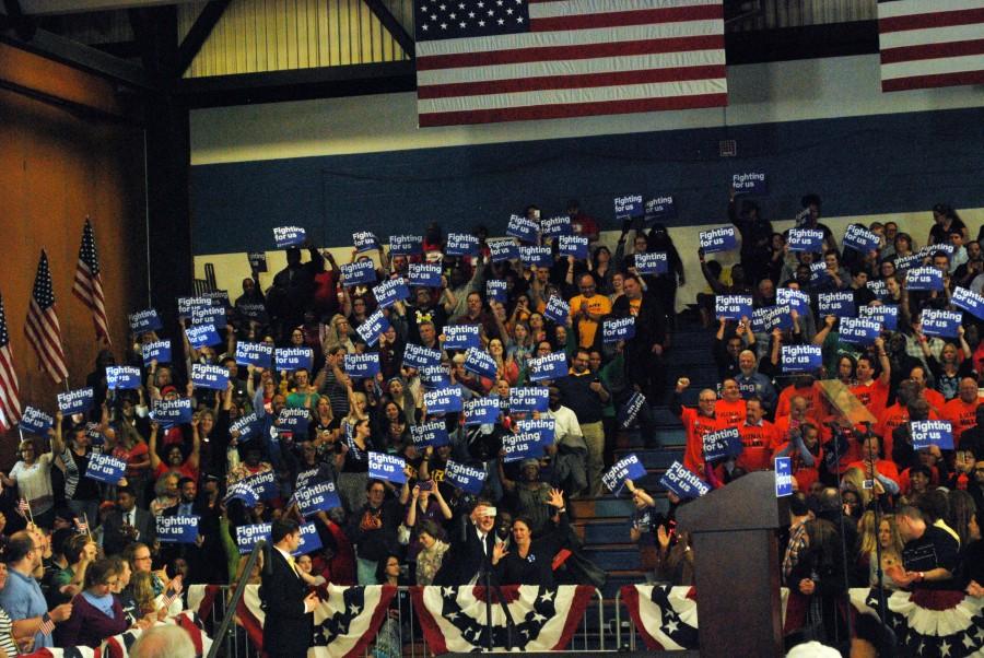 People attending the free rally were also given complementary signs sporting Clinton's campaign slogan, "Fighting for us."