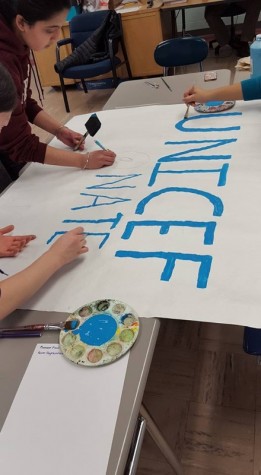 UNICEF club members advertise for their first fundraiser, "Dollars for Donuts."