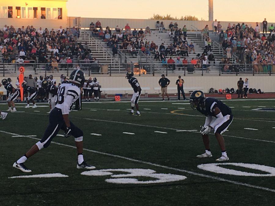 Twinsburg wide receiver Christian Edgerson lines up against Solon cornerback Darryl Sinclar.