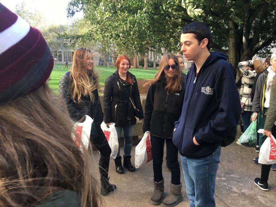 Junior Justin Pollak at MIT speaking into a structure on campus that allows you to hear your voice echo.