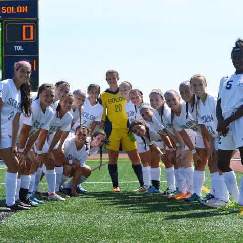 The team posed for a photo on Stewart Field.