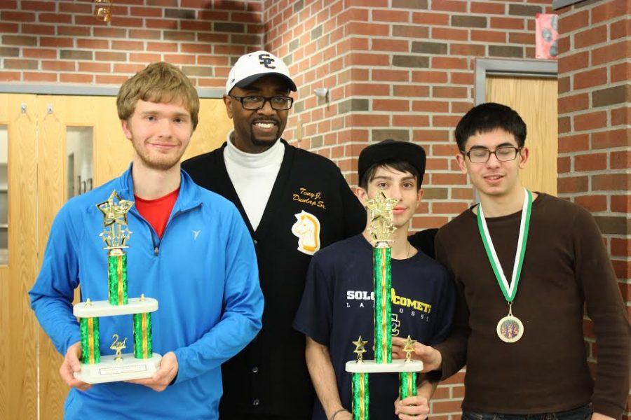 From left: senior Ian Golias, coach Tony Dunlap, senior Colin Rizer and senior Hounein Arbaji.