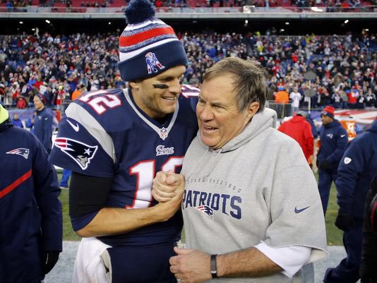 caption: Quarterback Tom Brady and head coach Bill Belichick will attempt to win their fifth ring together in Super Bowl LI.