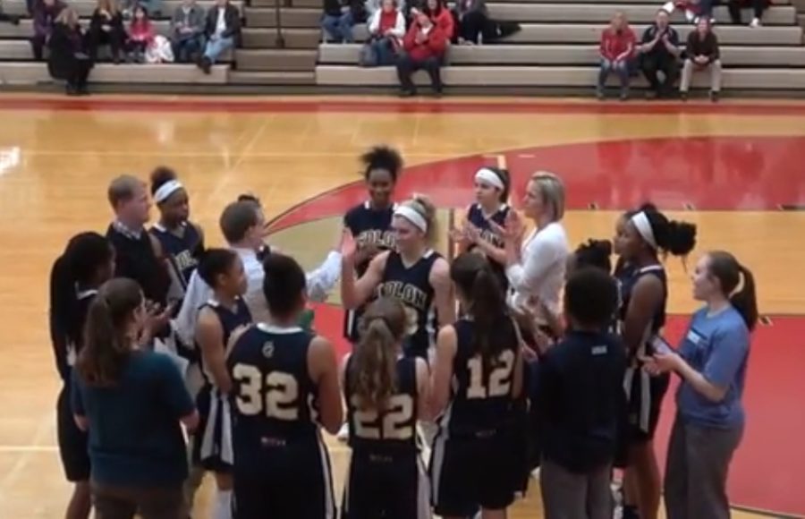 Bekelja's teammates congratulate her after breaking the record.