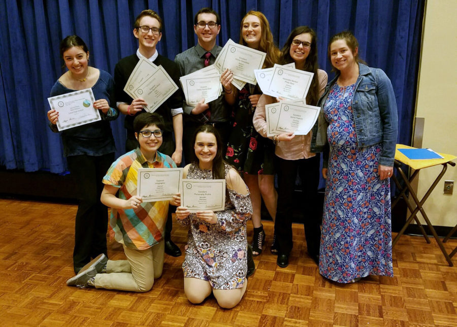 The Courier staff with their awards.