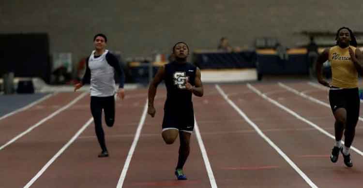 Junior Thomas Wilks at an indoor track meeting.