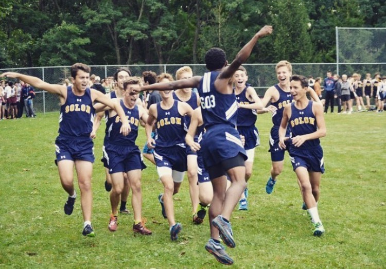 Senior co-captain David Howell (front) celebrates with his team after the Kenston Frank Gibas Invitiational on Sept. 2.