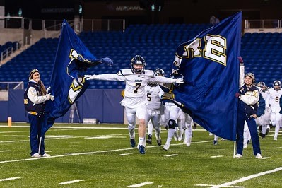 Comets taking the field in last year's playoff game at Tom Benson Hall of Fame Stadium. Photo Courtesy of Doug Wolfe 
