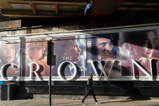 A panoramic billboard advertising the latest series of Netflix's 'The Crown' which is now airing on demand, shows the main characters of the British royal family - and featuring the relationship and romance between Prince Charles and Diana, Princess of Wales (Photo by Richard Baker / In Pictures via Getty Images)