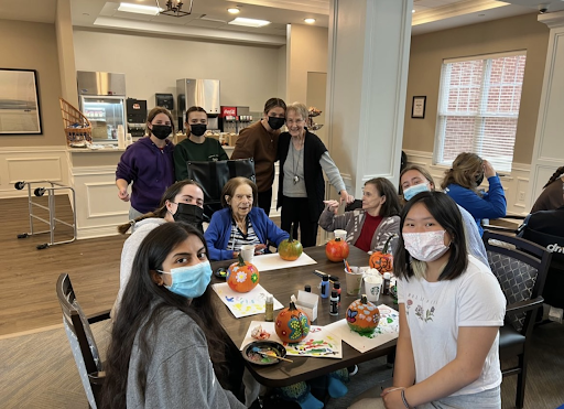 Young Heart Club members at Vitalia painting pumpkins. Photo courtesy of Max Moses