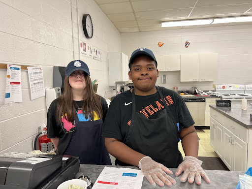 Cafe students Savannah Haas and Trentyn Hogue working on the cash register during their shift.