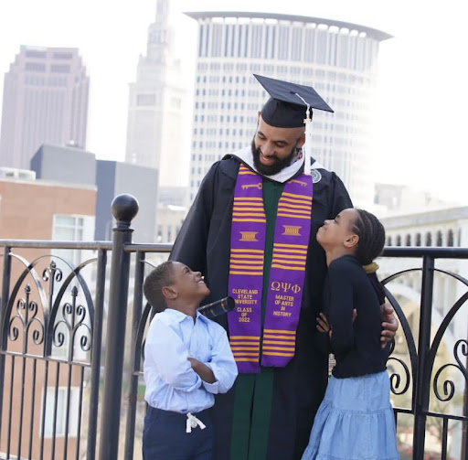 Aaron Jeter with his two children at the Wolstein Center at his graduation from Cleveland State University where he earned a Master's degree in Arts and History allowing him to become a visiting non-paid faculty member at Kent State University.  Photo courtesy of Aaron Jeter.