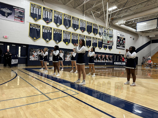 Cheerleaders performing for the Girls Basketball team for the first time on Dec. 9. Photo taken by Sasha Zahler.