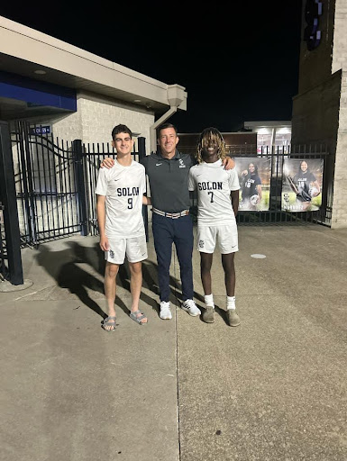 Soccer Players Malec Jirari and Fasi Embacher with Coach Ingerman. Photo courtesy of James McMeechan.