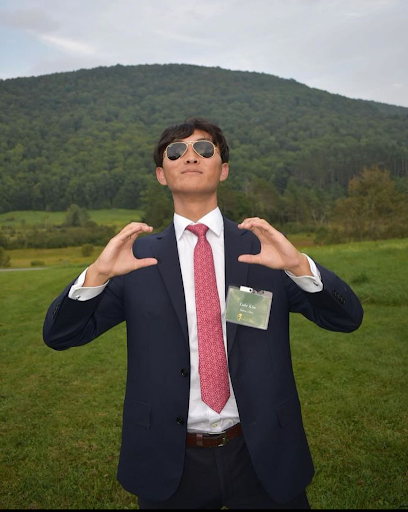 Luke Kim at the Coolidge Senator Summit in Vermont. The hands represent Calvin Coolidge. 