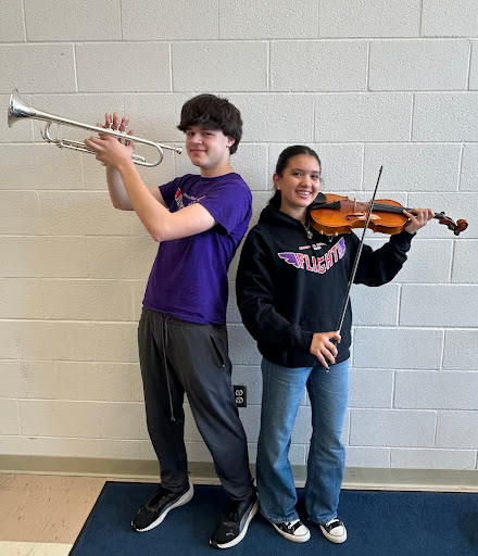Mark Mallia and Lovelia Solarte posed with their instruments at SHS. 