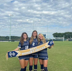 Ryan (on right) stands with her new soccer teammates, Stella Jones and Margo Pritchard, in uniform at the Naval Academy. Photo courtesy of Sophia Ryan. 