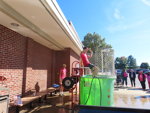 Prepared for a splash, Senior, Noah Prample, sat above the water at Solon High School's annual Dunk Tank on Oct. 10. 